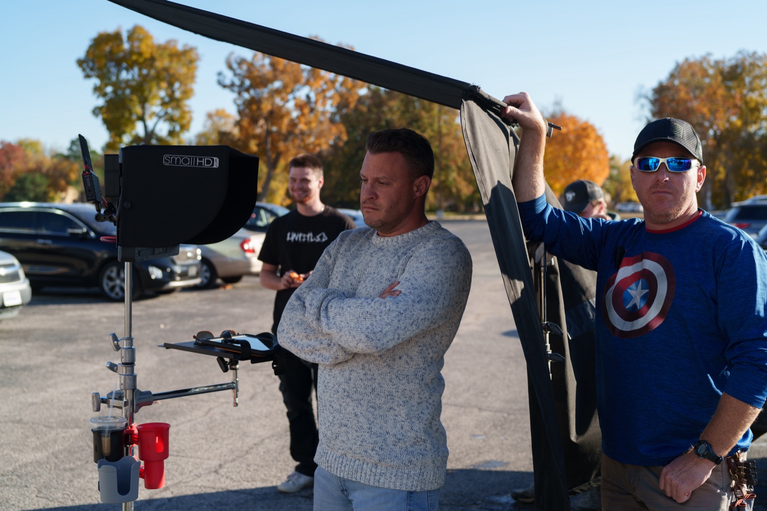 Jonathan Coussens with the boom operator on a location exterior.